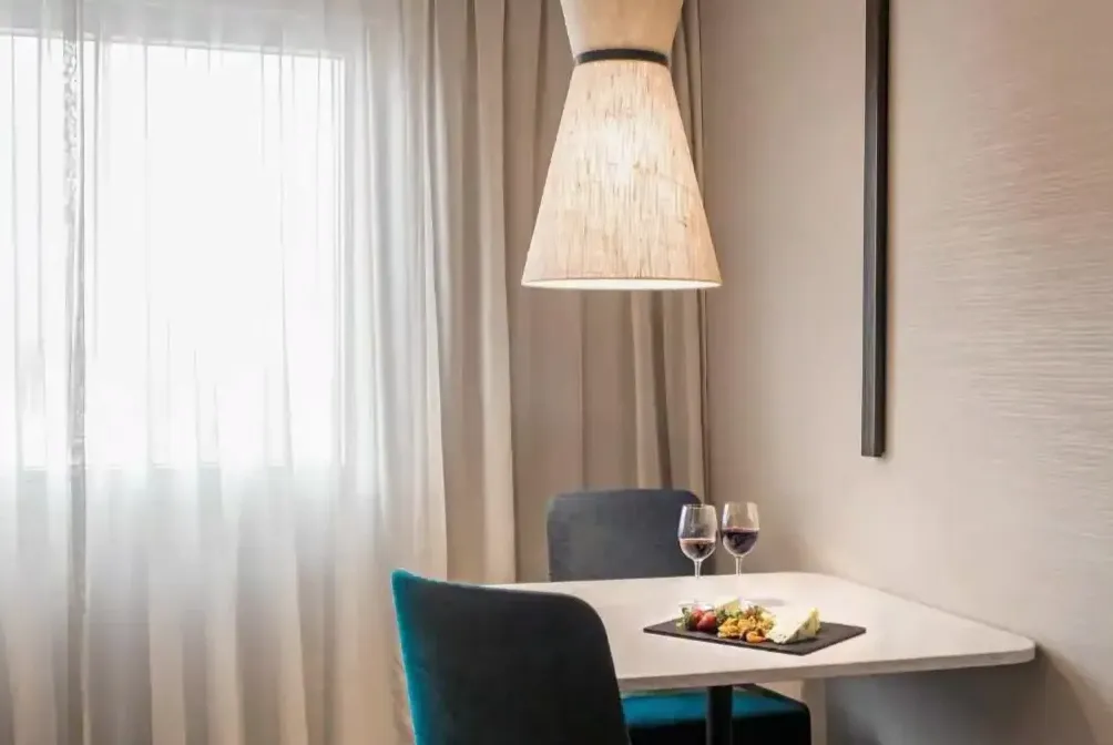Sommelier decanting at table